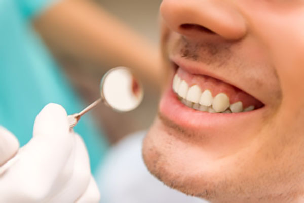 Is Gum Reshaping In Cosmetic Dentistry Painful?